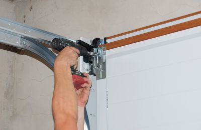 Garage Door Spring Repair And Replacement